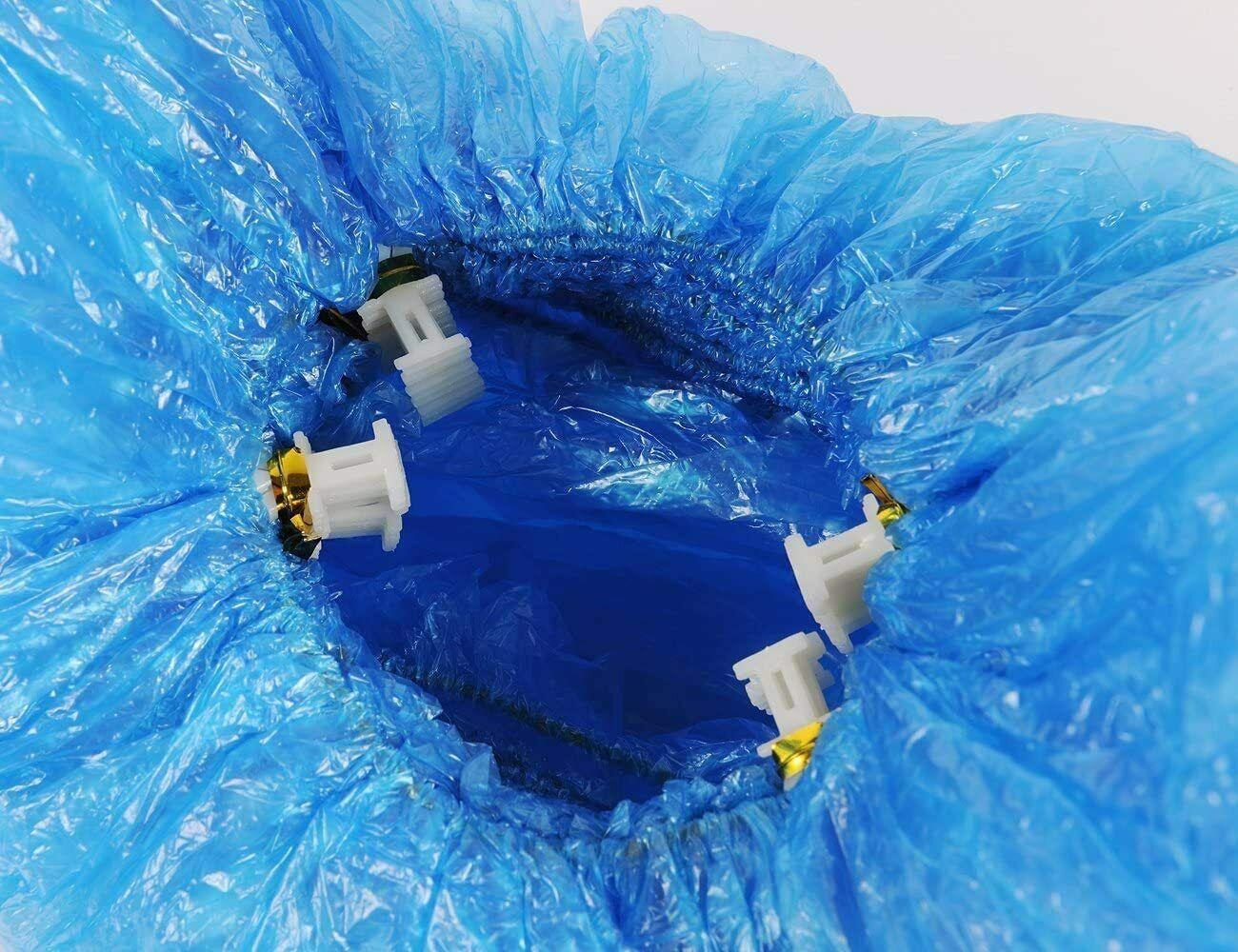 Juego de cubrezapatos para dispensador automático.